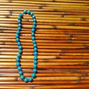 Wooden bead necklace.